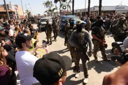 L.A. County supervisors are set to ban masks worn by ICE agents. Can they win a battle with Trump?