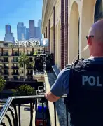 Burglary suspects walk across building ledge seven stories up to avoid arrest, police say